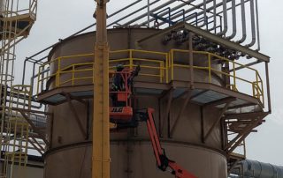 A picture of a catwalk around a roof top unit.